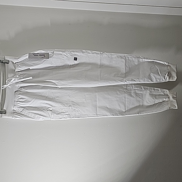 Scrubs, butter-soft. White with lots of pockets.  Cuff style. Size small… - Picture 1 of 8